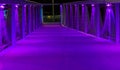 Neon purple lighted bridge walking road modern architecture in scheveningen a popular city in the netherlands