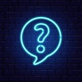 Neon question mark in speech bubble. Glowing blue question sign. Color neon banner on brick wall. Realistic bright night