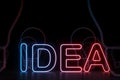 Neon red blue idea sign, light bulbs background Royalty Free Stock Photo