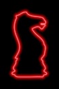 Neon red contour chess figure knight on a black background