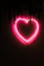 Neon red heart on black wall Royalty Free Stock Photo