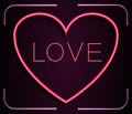 Neon red heart with inscription LOVE on a pink background Royalty Free Stock Photo