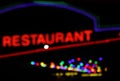 Neon restaurant blur image at night with bokeh