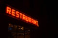 Neon Restaurant Sign by Night Royalty Free Stock Photo