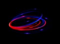 Neon rings set. Vector illustration of neon rings on dark background. Abstract vector fire circles, sparkling swirls and Royalty Free Stock Photo