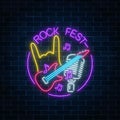 Neon rock festival sign with guitar, microphone and rock gesture in round frame. Live music in open air icon.