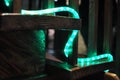 Neon rope light snakes its way up an old wooden stairway Royalty Free Stock Photo