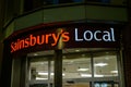 Neon Sainsbury\'s Local Sign Above Store Entrance