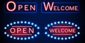 Neon shining signboard with word open and welcome