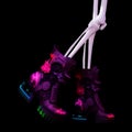 Neon shoes on skeleton legs Royalty Free Stock Photo
