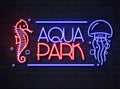 Neon sign aqua park with sea hourse and jellyfish. Vintage electric signboard Royalty Free Stock Photo