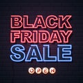 Neon sign black friday sale open on brick wall background. Royalty Free Stock Photo