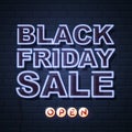 Neon sign black friday sale open on brick wall background. Royalty Free Stock Photo