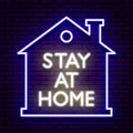 Neon sign, blue outline of a house with a chimney. In the center is white inscription `Stay at home`.