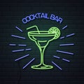 Neon sign cocktail bar on brick wall background. Vintage electric signboard Royalty Free Stock Photo