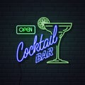 Neon sign cocktail bar on brick wall background. Vintage electric signboard Royalty Free Stock Photo