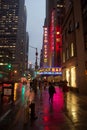 Neon sign for the famous Radio City Music Hall reflected on a wet sidewalk Royalty Free Stock Photo