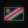 Neon sign in the form of the flag of Namibia. Against the background of a brick wall with a shadow.