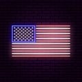 Neon sign in the form of United States of America flag. Against the background of a brick wall with a shadow. Royalty Free Stock Photo