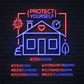 Neon sign hashtag stay home in different languages. COVID-19 protection methods. Coronavirus Quarantine Warning.
