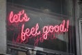 Neon sign let& x27;s feel good in red Royalty Free Stock Photo