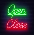 Neon sign open and close on brick wall background. Royalty Free Stock Photo