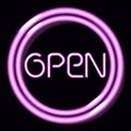 Neon sign Open. Pink round frame on a dark background