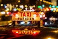 Neon sign of a Parisian taxi