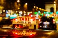 Neon sign of a Parisian taxi