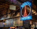 The neon sign for Profi\'s Creperie in the historic Reading Terminal Market, an enclosed
