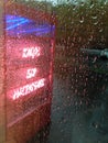 Neon sign in rainy day
