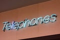 Neon sign reading Telephones