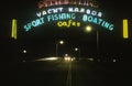 A neon sign that reads Ã¯Â¿Â½Yacht Harbor, sport fishing boating cafesÃ¯Â¿Â½