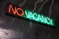 Neon Sign stating No Vacancy in red and green with storm clouds , rain and lightning