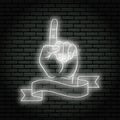 Neon sign with white glow. Hand gesture, shows index finger up. On a brick wall background, for your design. With ribbon, flag