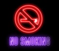 Neon signboard of `NO SMOKING`. Shiny glowing light and warning about unhealthy habit