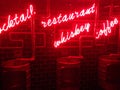 Neon signs and barrel urinals in a pub in Shanghai