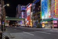 Neon signs and bright advertising lights lit the main street of famous Akihabara`s electronics shopping area Royalty Free Stock Photo