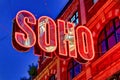 Neon signs for the neighborhood Soho at night London United Kingdom