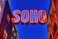 Neon signs for the neighborhood Soho at night London United Kingdom