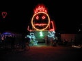 Neon smiley face at Burning Man 2010