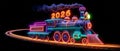 Neon Space Train with 2026 Sign Over Planet Surface Royalty Free Stock Photo