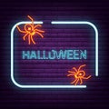 Neon spider sign arachnid logo on the wall. Royalty Free Stock Photo