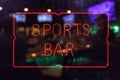 Neon Sports Bar Sign, Rainy Window Blur Image Royalty Free Stock Photo