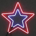 Neon star on concrete background