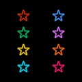 Neon stars on a black background . Royalty Free Stock Photo