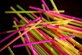 Neon straws on a table Royalty Free Stock Photo