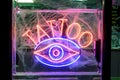 Neon Tattoo Sign at Night Royalty Free Stock Photo