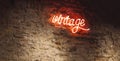 Neon vintage sign on old red bricks wall