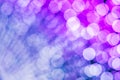Neon violet blue abstract background of blue bokeh defocused blurred lights circles. Royalty Free Stock Photo